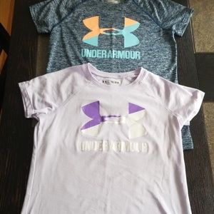 2 girls under armour shirts